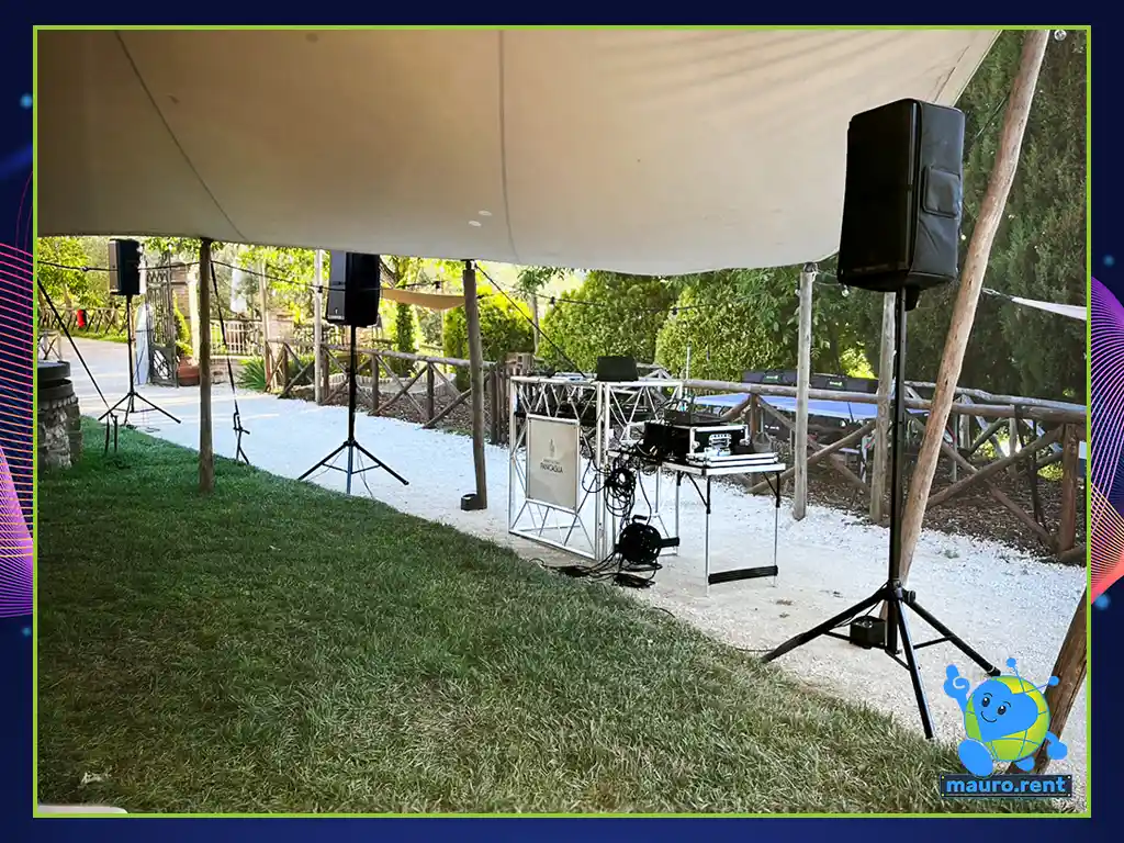 Professional DJ setup with Accu Stand Pro Event Table and RCF Art 912A speakers at Borgo Castello Panicaglia outdoor party