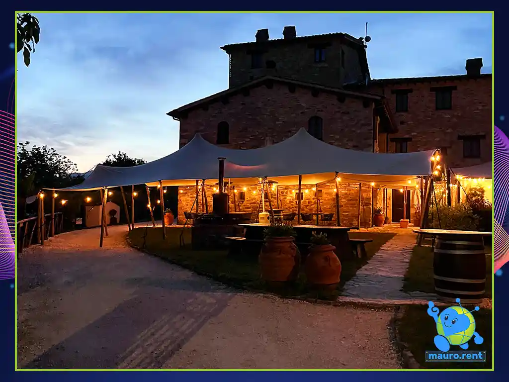 Borgo Castello Panicaglia panoramic view at dawn with technical flight cases and transport van packed after destination wedding breakdown