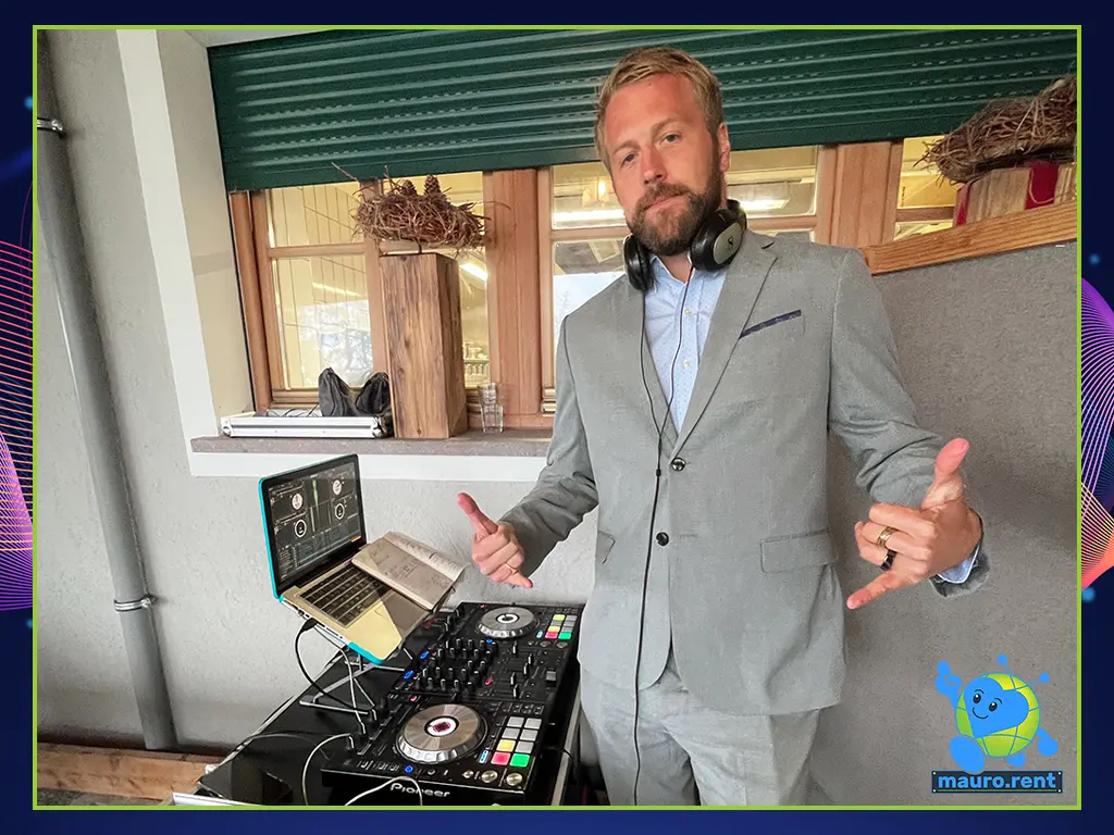 DJ Willionaire operating his Pioneer DDJ-SX2 controller connected to a MacBook Pro at the mauro.rent DJ booth inside the Col Pradat lodge.