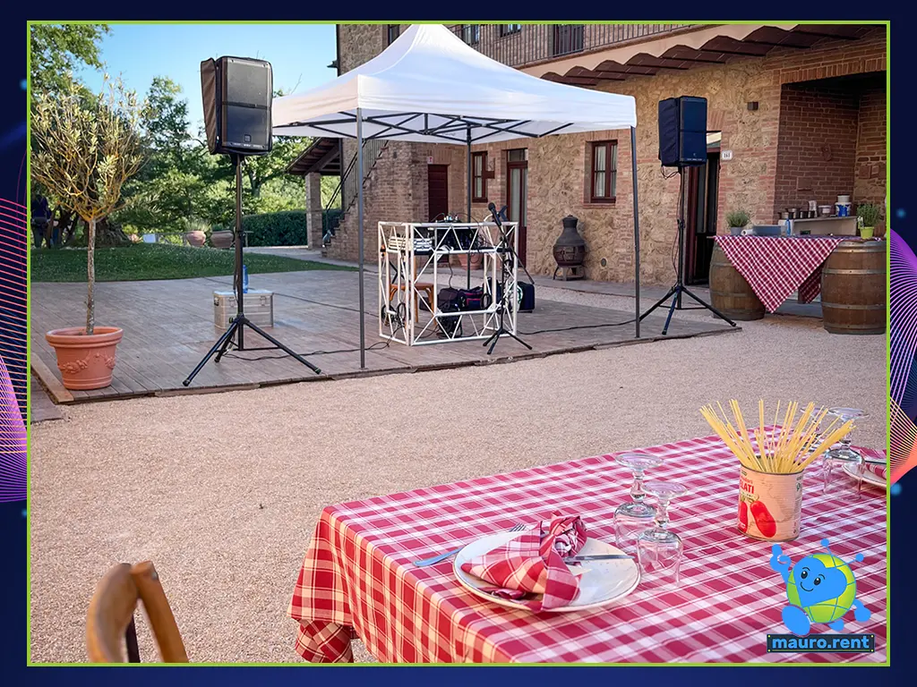 The rustic Pizza Party welcome setup at Agriturismo Terre di San Galgano, featuring a completed RCF Art audio system and a neat cable layout.