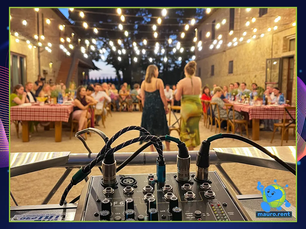 Behind-the-scenes view of Mauro's control station featuring the RCF F 6X mixing console during guest speeches at the San Galgano Pizza Party.