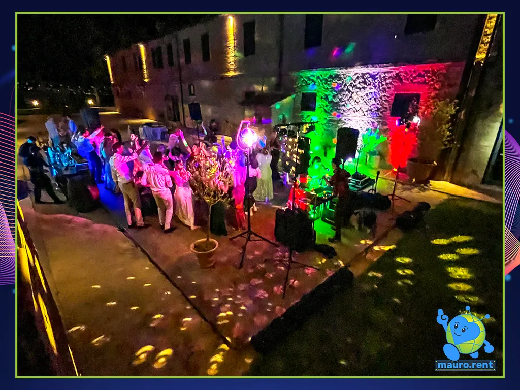 Featured image of the complete wedding dance floor and audio-lighting setup at Terre di San Galgano, captured from an elevated perspective on the venue stairs.
