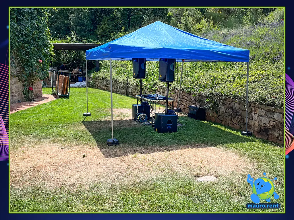Behringer sound system setup under gazebo at Villa Capanne with pathway to pool in background