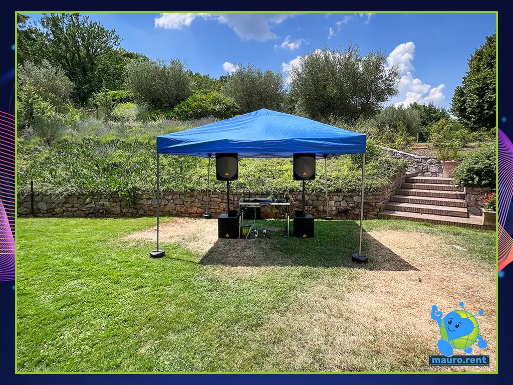 Panoramic view of Villa Capanne farmhouse courtyard featuring the gazebo audio setup and outdoor stone stairs