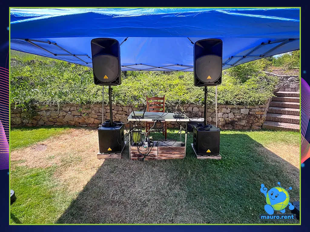 Front view close-up of the complete Behringer active speaker and subwoofer stack under the gazebo at Villa Capanne