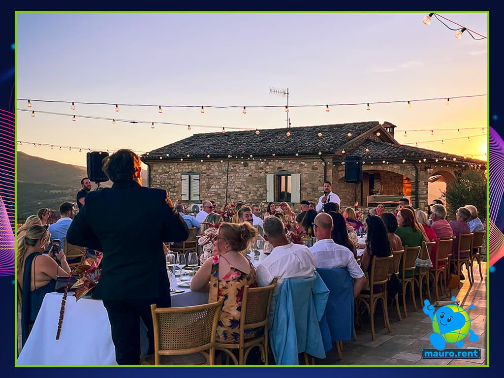 Groom Josh giving his wedding toast with Shure microphone at La Torre di Celle sunset dinner