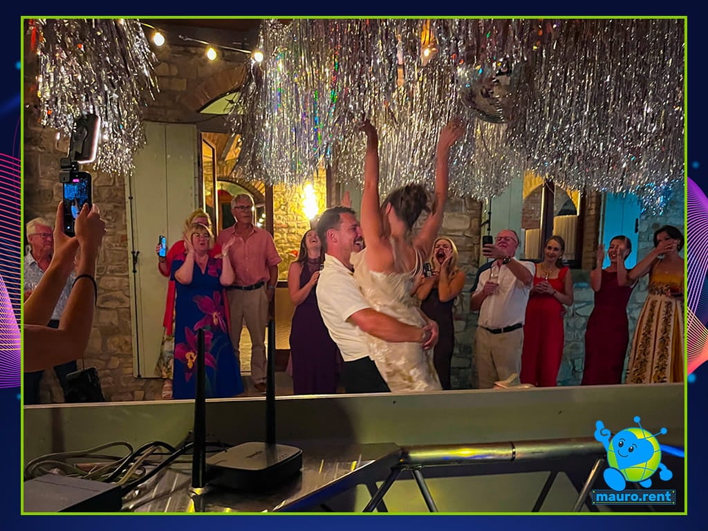 Mollie and Josh First Dance surrounded by guests at La Torre di Celle Mamma mia party