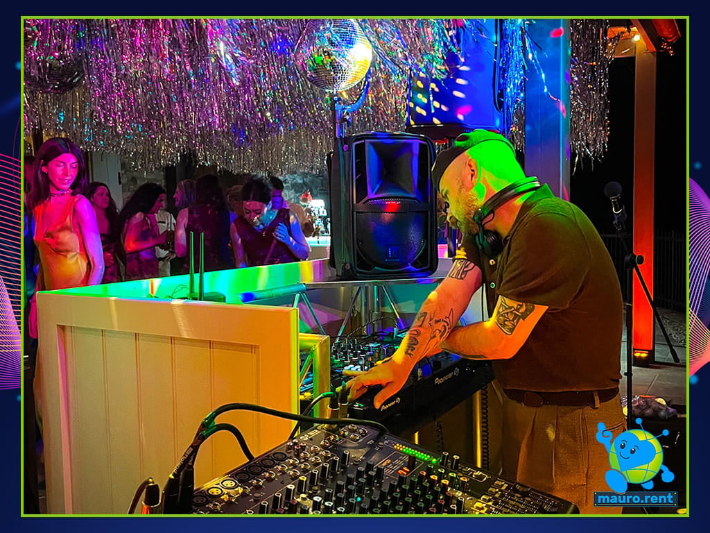 DJ Stuart D Alexander performing at Pioneer DJ console during Mamma mia party at La Torre di Celle