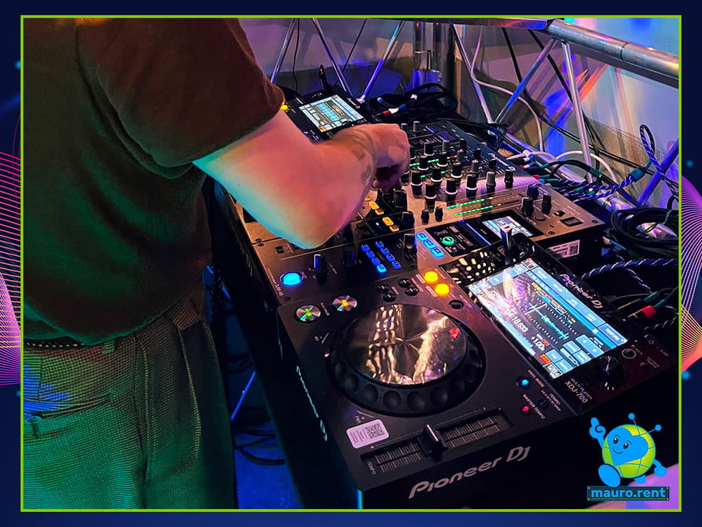 Close up of illuminated Pioneer DJM A9 mixer and XDJ 700 players during Mamma mia party at La Torre di Celle