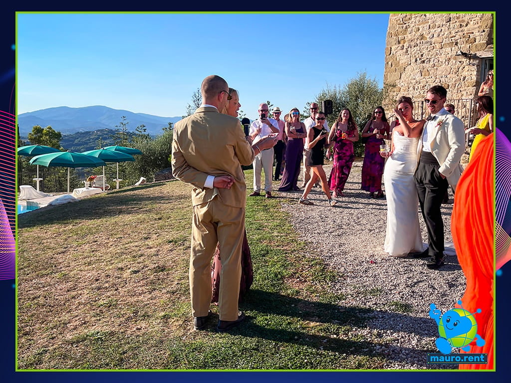 Maid of Honour Rachel speaking with Shure microphone and RCF Art 708-A MK5 speaker in background at La Torre di Celle